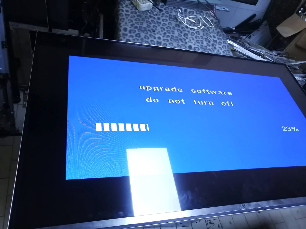 Television screen showing a software upgrade in progress