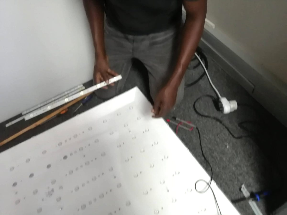 Measuring an LED backlight strip against the diffuser sheet of an open television